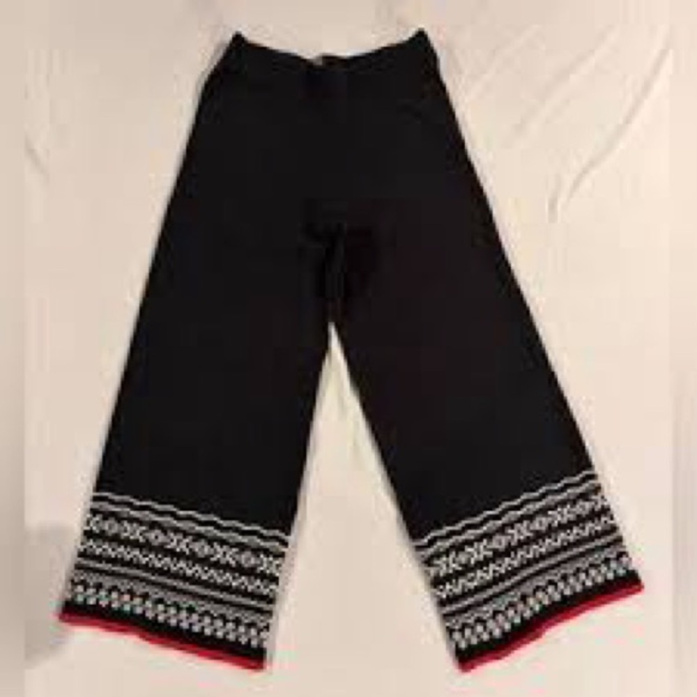 Black Wide-Leg Pants with Patterned Hem. 71% cotton 29% polyester. - Picture 5 of 5